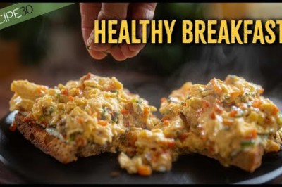 Scrambled Eggs with Vegetables on Sourdough Toast with Greek Yogurt and Seeds.